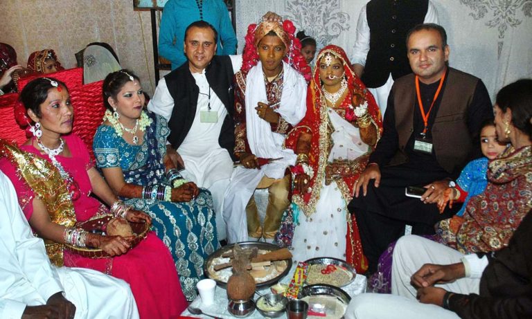 APP56-24
KARACHI: January 24 - Patron,Pakistan Hindu Council, Dr.Ramesh Vankwani in a group photo during the combined marriages program of 60 deserving couples organized by Pakistan Hindu Council. APP photo by Sahib Zaman